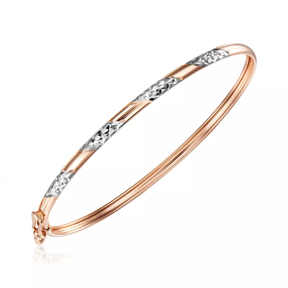 Gold bracelet with a diamond facet.