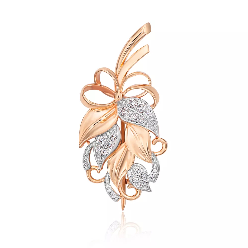 Gold brooch with cubic zirconia