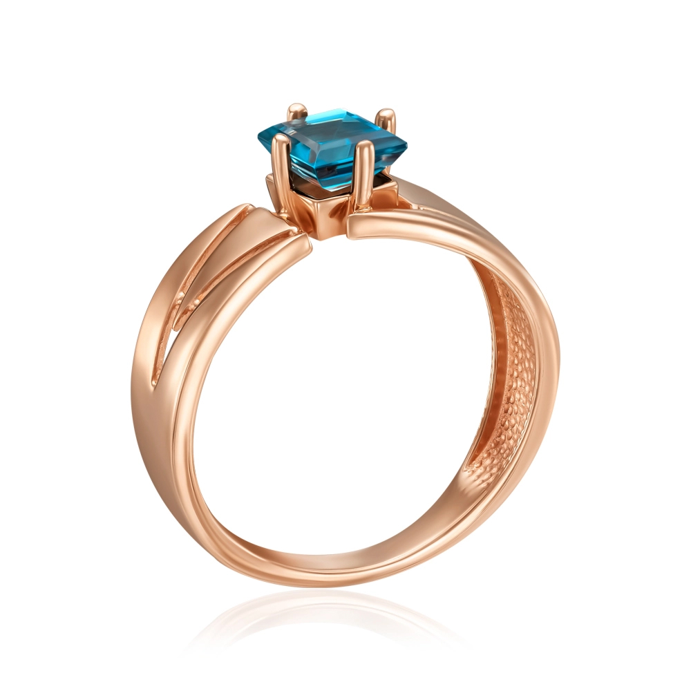 Gold ring with topaz