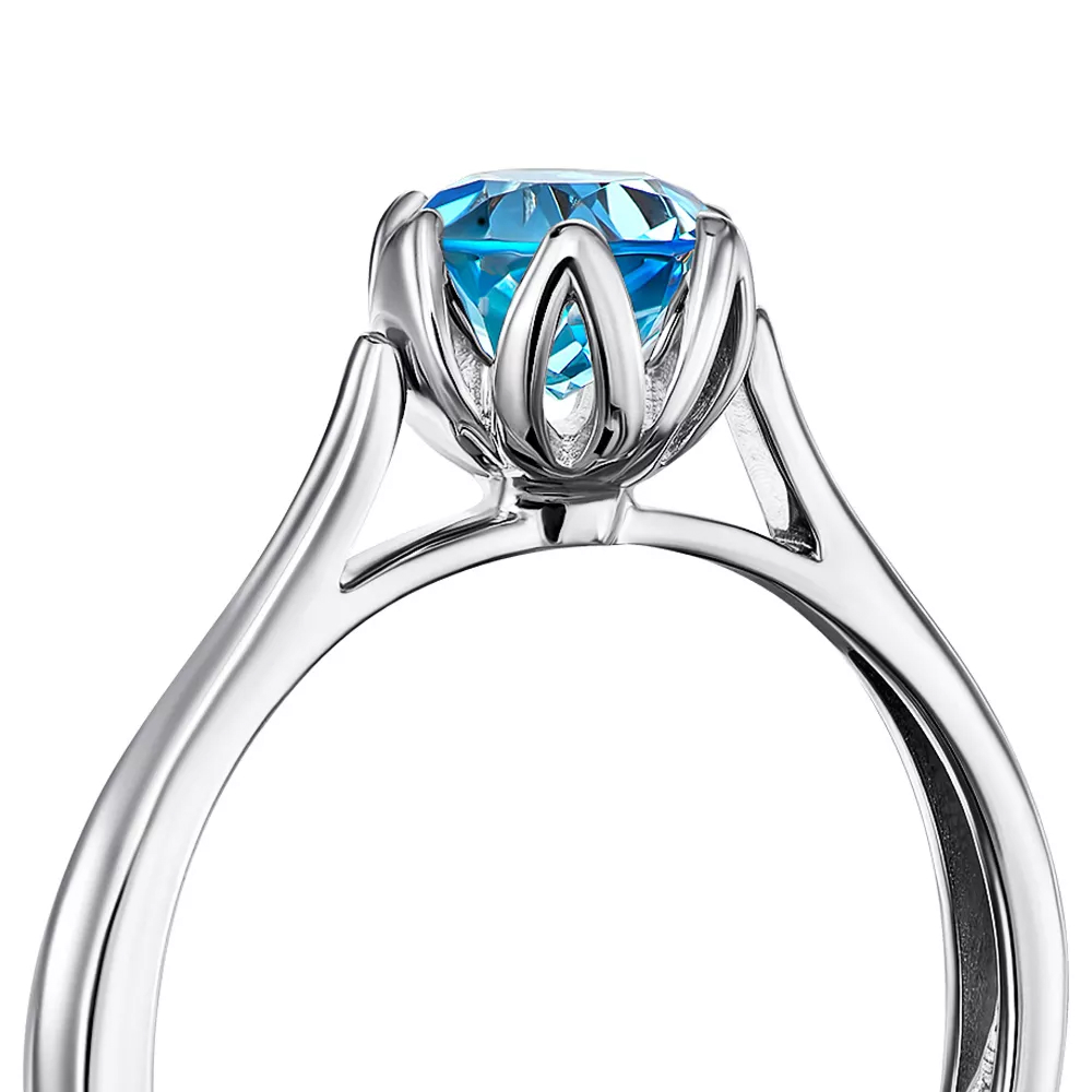 Gold ring with blue topaz