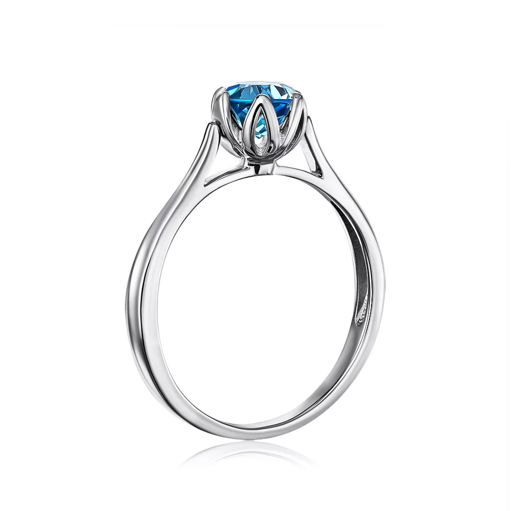 Gold ring with blue topaz