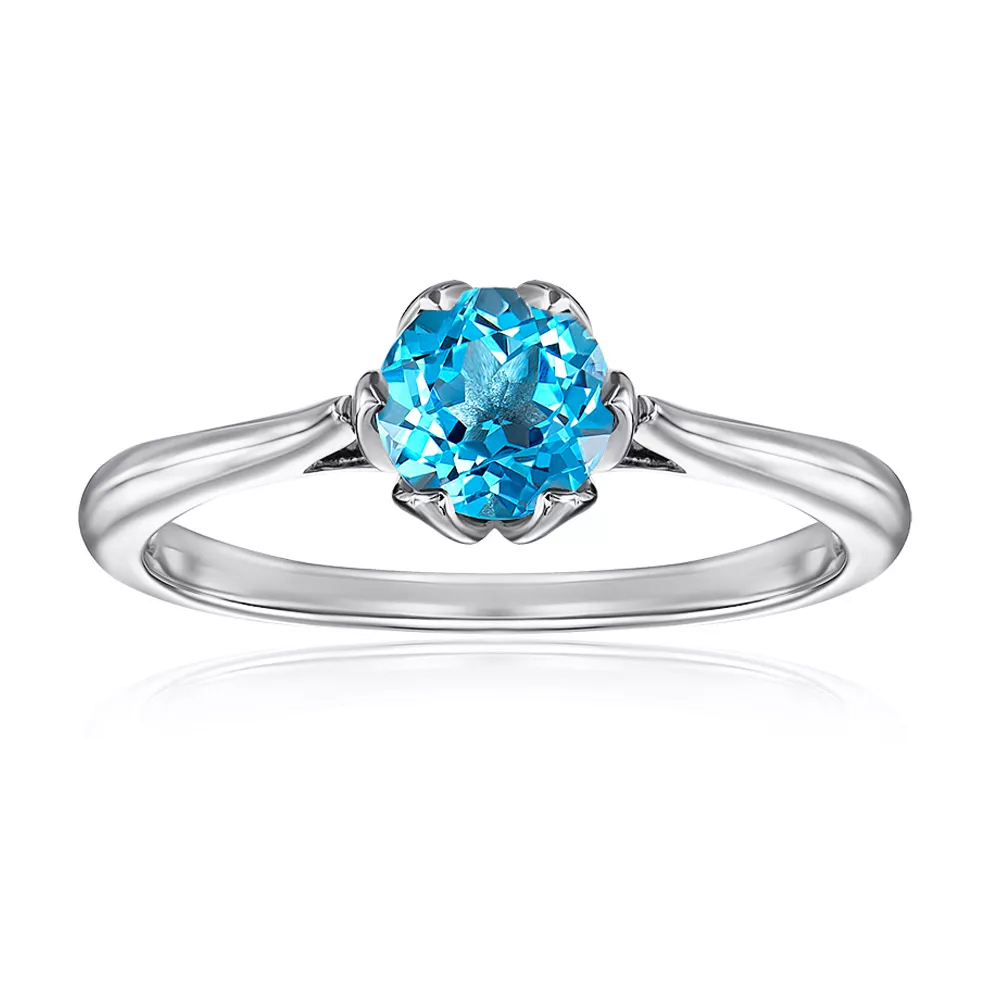 Gold ring with blue topaz