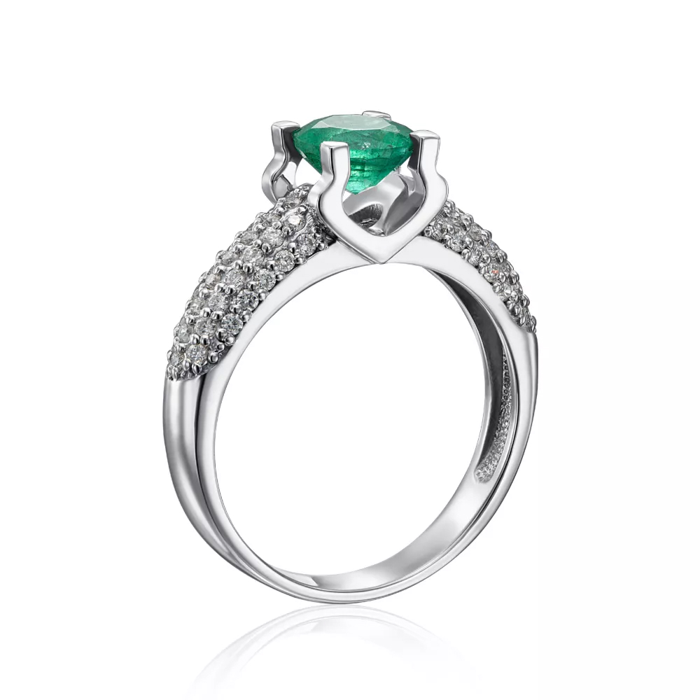 A gold ring with an emerald and diamonds